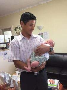 Dr. Zeng with clinic baby