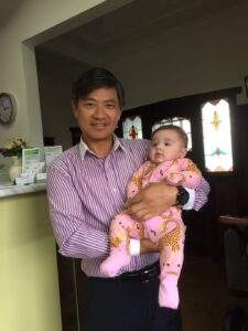 Acupuncturist Richard Zeng with baby