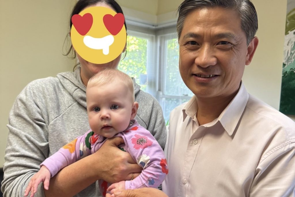When Should You Start Acupuncture for Fertility? 1 Dr Richard Zeng holding newborn baby after fertility acupuncture and IVF support in Melbourne